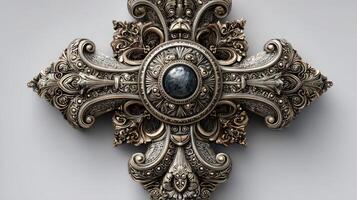 Intricate silver decorative cross featuring ornate designs with a central gemstone on display in an art gallery photo