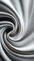 Swirling silver fabric creates a stunning pattern in soft light photo