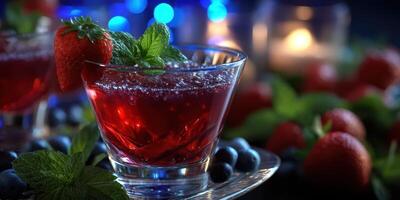 Refreshing berry cocktail served in a glass garnished with mint and strawberries at an evening gathering photo
