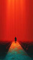 Silhouette in a vibrant red theater with empty seats at a tranquil moment photo
