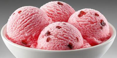 Delightful pink strawberry ice cream served in a bowl during a sunny summer day at a local dessert shop photo