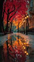 Stunning autumn alley with vibrant red leaves and shimmering reflections on a rainy day photo