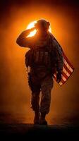 Soldier saluting at sunset while carrying American flag on a dusty landscape photo