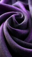 Soft purple fabric with a smooth texture draped in elegant folds highlighting intricate patterns and hues photo