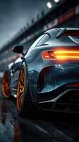 High-performance sports car parked on a wet racetrack during a cloudy evening photo