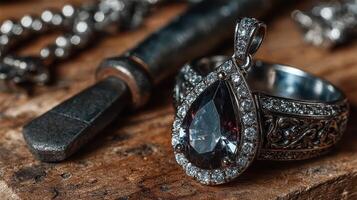 Beautiful vintage ring with a large gemstone displayed on a wood surface beside a crafting tool photo