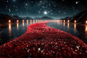Vibrant red sparkling pathway illuminated by distant lights, leading through a dark night landscape with a starry sky photo
