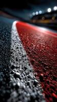 Curving racetrack surface with dramatic lighting at night capturing the essence of motorsport photo
