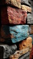 Textured stones arranged closely showcase vibrant colors and intricate patterns in a decorative wall design photo