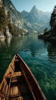 Serene boat ride on a calm lake surrounded by majestic mountains during the early morning light photo