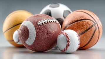 Variety of sports balls displayed on a neutral background showcasing popular games played around the world photo