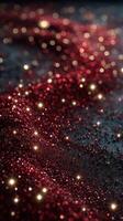 Bright red glitter sparkles on a dark background creating a festive atmosphere perfect for celebrations and events photo