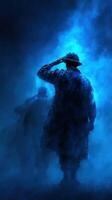Soldiers in silhouette salute against a misty blue backdrop during a solemn remembrance ceremony at dusk photo