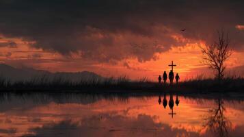 People walking towards a cross in a scenic sunset by the water in a tranquil setting photo