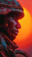 Soldier in profile against vibrant sunset background evoking strength and resilience during military training exercise photo
