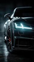 Sleek luxury sports car with illuminated headlights in a dark environment showcasing modern design details and elegance photo
