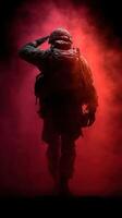 Soldier saluting in a misty atmosphere during a dramatic backdrop at dusk photo