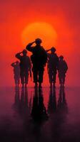 Soldiers saluting the sunset during a military training exercise in a desert location photo