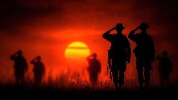 Soldiers saluting at sunset during a solemn ceremony on a quiet evening photo