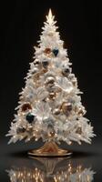 Elegant white Christmas tree adorned with golden and blue ornaments, glowing in a dark setting during the holiday season photo