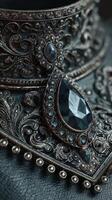 Intricate silver jewelry detail showcasing elegant craftsmanship and intricate designs with dark gemstones and filigree work photo
