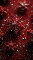 Snowflakes adorn a red background creating a festive holiday atmosphere during winter celebrations photo