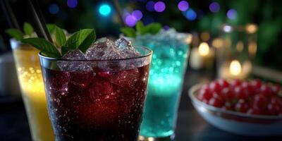 Colorful cocktails with mint and ice at an outdoor evening gathering under fairy lights photo