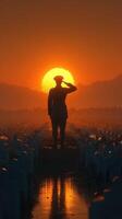Soldier saluting at sunset in cemetery with rows of tombstones and distant mountains in the background photo