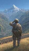 Soldier saluting during a military ceremony in a mountainous landscape under clear skies photo