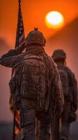 Soldiers salute the flag during a sunset in a desert landscape photo