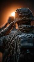 Soldier salutes during sunrise in a frosty environment, highlighting dedication and resilience in challenging conditions photo