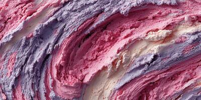Creamy swirls of colorful frozen dessert with hints of berry and vanilla captured in a close-up view photo