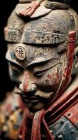 Ancient warrior statue with intricate details in traditional attire from historical dynasty era photo
