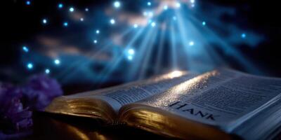 Light rays illuminate an open book with a reflective surface, creating a serene atmosphere in a dark setting photo