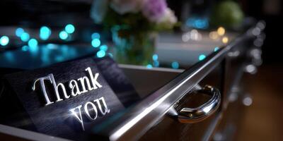 Thoughtful gesture displayed with a thank you sign beside glowing decor in a cozy indoor setting photo