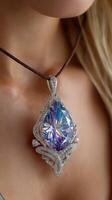 Elegant pendant with colorful gemstone displayed on a model's neck in soft lighting photo