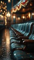 Vintage theater seats illuminated by soft lights create a nostalgic atmosphere in an elegant concert hall during a quiet evening photo
