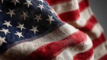 American flag waving softly against a dark background showcasing its vibrant colors and intricate fabric details photo