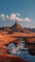 Majestic mountain landscape during golden hour with reflections in the serene water photo