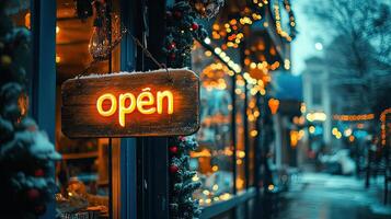 A sign that says open is hanging in front of a store photo