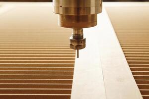 CNC milling machine. Machine tool in wood factory with drilling machines. photo