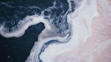 A close up of a pink and white liquid photo