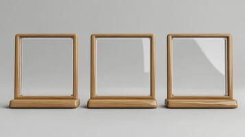 Three wooden frames with glass on them photo