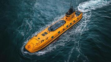 A yellow submarine traveling in the ocean photo