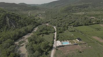 Aerial panorama highway road and Luxury Villa in Kakheti Region Tranquil Retreat for Travel and Relaxation in the Heart of the Caucasus Mountains.Efficient Space Planning and Functional Architecture video