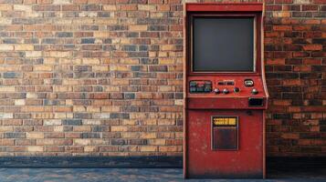 An old arcade machine is sitting against a brick wall photo