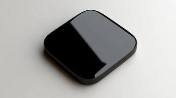 A black square shaped object on a white surface photo