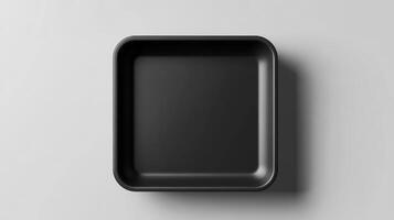 Black rectangular tray on a white surface photo
