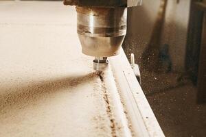 CNC router machine creates a layout of the shelf complex. photo