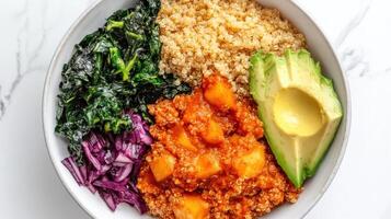 A bowl with rice, vegetables and avocado photo